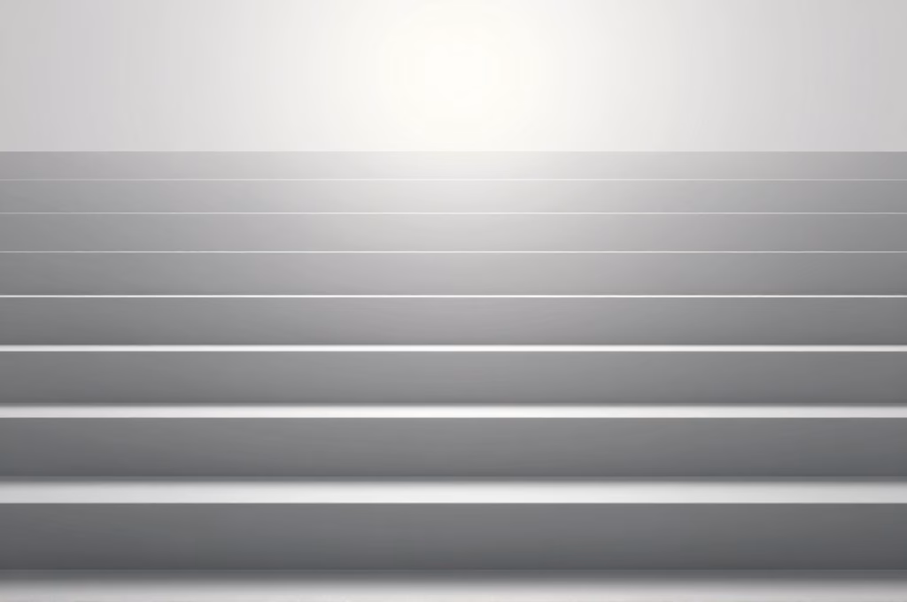 Escalier progressif menant vers un objectif lumineux, représentant les étapes du tunnel